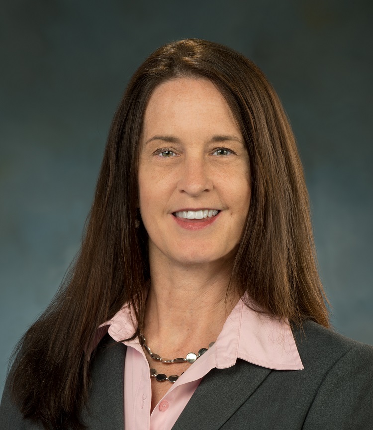 Photo of Karen Buck Grey Jacket Pink Shirt Smile Long hair