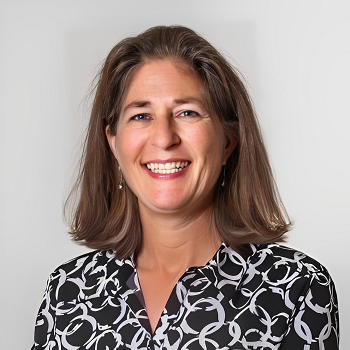 Smiling Photo of Bonnie Spay with Black & White printed blouse